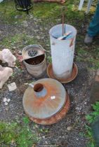 Two Incinerator lids, a chicken feeder, and a galvanised mop bucket.