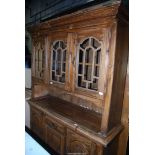 A pine dresser with glazed top, 60'' wide x 17'' deep x 80'' high.