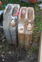 Two Military 1952 Jerry cans, and a gate hanging plastic feeder.