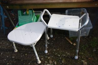 Two adjustable mobility stools.