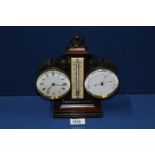 A combination barometer/ thermometer desk clock with key, 9" tall.