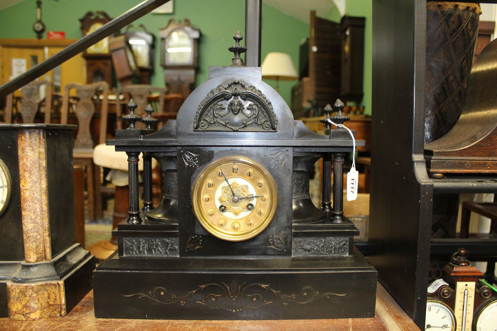 A large Victorian black slate mantle Clock with gilded dial Arabic numerals, dome top,