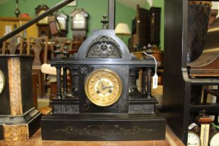 A large Victorian black slate mantle Clock with gilded dial Arabic numerals, dome top,