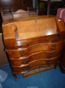 A continental design serpentine fronted lady's Writing Desk having urn and scroll inlaid decoration,