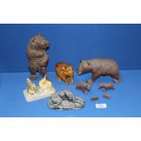 A family of Black Forest wooden bears, a carved elephant,