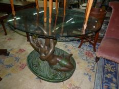 An arty circular bevelled plate glass topped Centre Table,