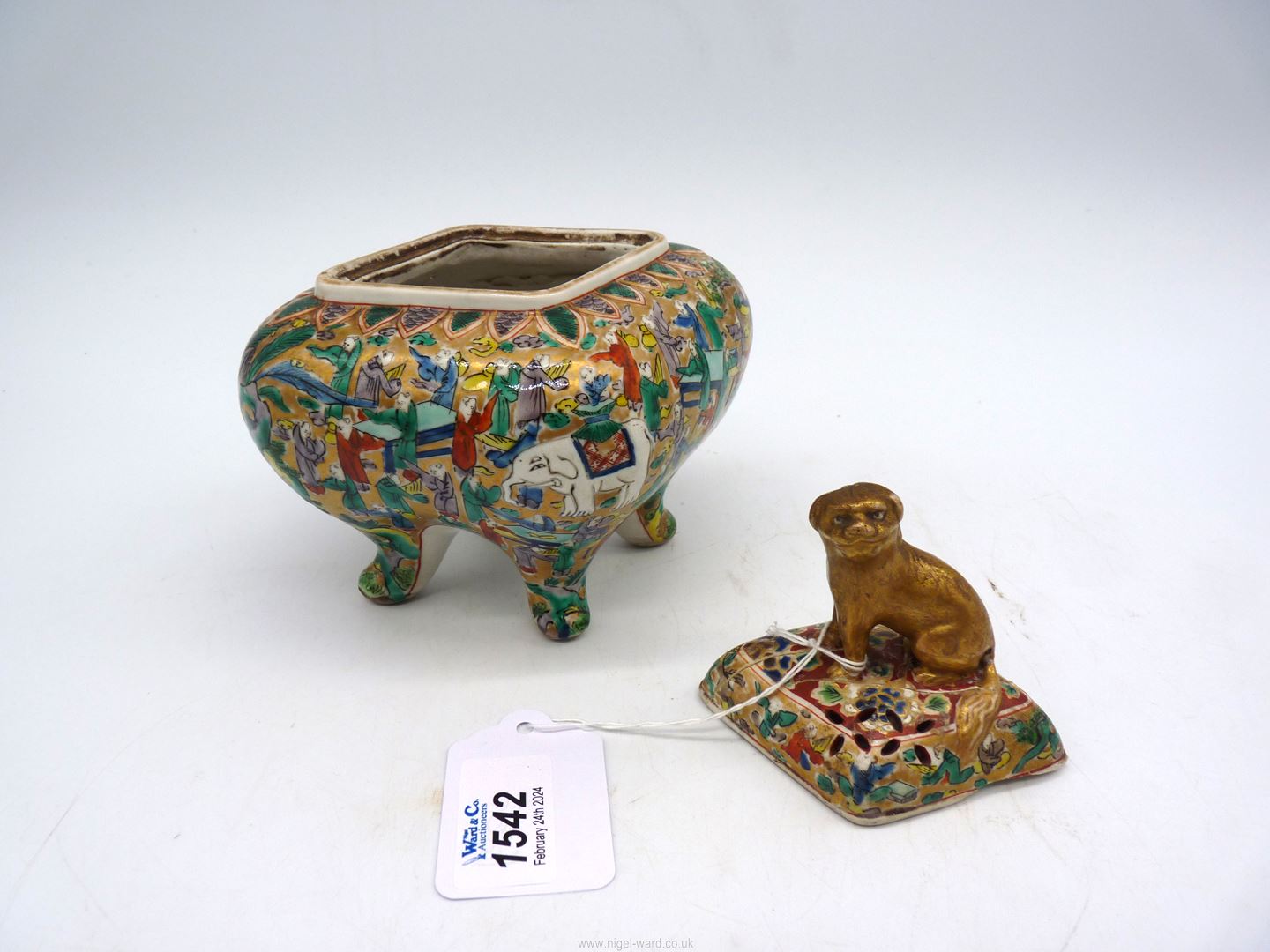 An Oriental diamond shaped footed and lidded pot with scenes of Elephants and sages with papers at - Image 2 of 3