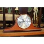 A Hermle 'Napoleon Hat' Mantle clock, with key, 19 3/4'' wide overall.