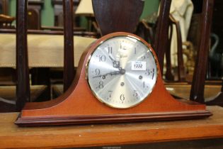 A Hermle 'Napoleon Hat' Mantle clock, with key, 19 3/4'' wide overall.