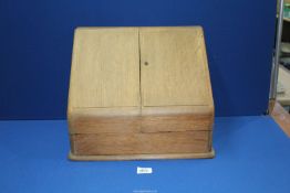 An Oak sloping stationary box a/f with integral desk calendar 16" wide x 11" depth x 12" high,