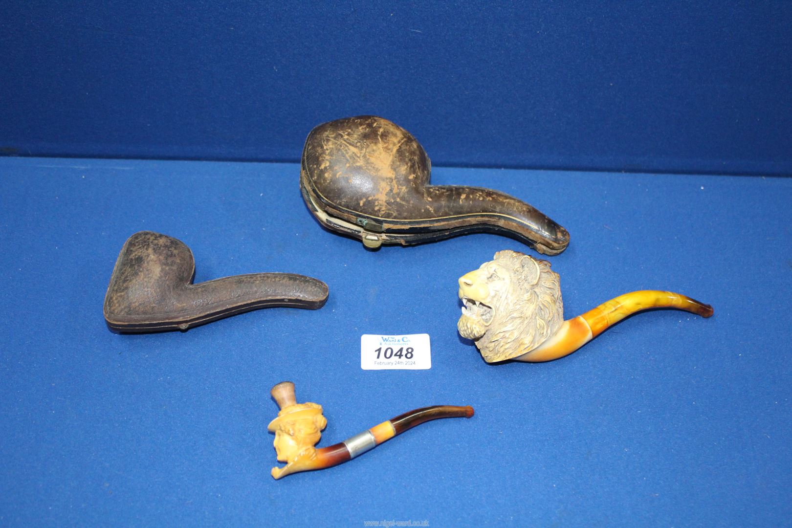 Two antique meerschaum Pipes, cased with amber stems, the larger one carved as a male lion's head, - Image 2 of 2