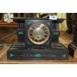 A slate and malachite Mantle Clock having Roman numerals in gold on a black border,