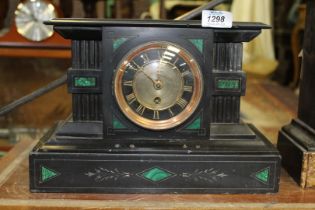 A slate and malachite Mantle Clock having Roman numerals in gold on a black border,