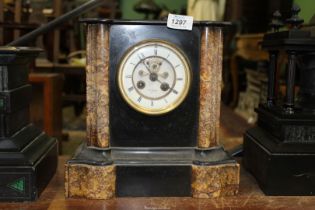 A slate and polished stone Mantle Clock by Henry Marc, Paris,