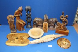 A quantity of treen including elephant bookends, tribal figures, crocodile etc.