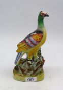 A Staffordshire figure of an exotic bird c1850, 9 3/4" tall.