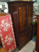 A circa 1900 Mahogany Linen Press style Wardrobe having dentil frieze,