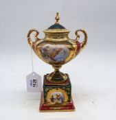 A Vienna porcelain urn shaped vase on plinth, Beehive mark, 9" tall.