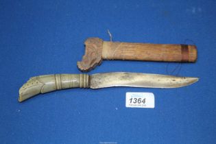 A Dagger having carved horn handle, with sheath, overall length 10''.