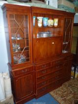 A contemporary Yew wood break front Lounge Unit with a drinks cabinet flanked by 13 panel glazed