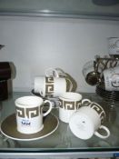 A Wedgwood coffee set six cups and six saucers in 'Greek Keystone' by Susie Cooper designs.