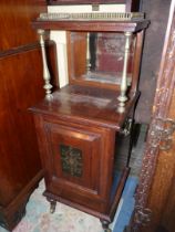 A circa 1900 Mahogany Purdonium/Cabinet of impressive quality and having a raised and fielded door