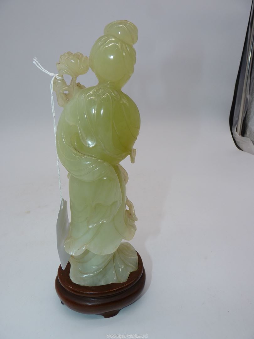 A Jade coloured sculpture of an oriental Geisha figuer in a swirling dress and holding a flower - Image 2 of 5