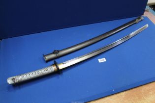 A WWII Japanese Non Commissioned Officer's Sword, with iron scabbard,