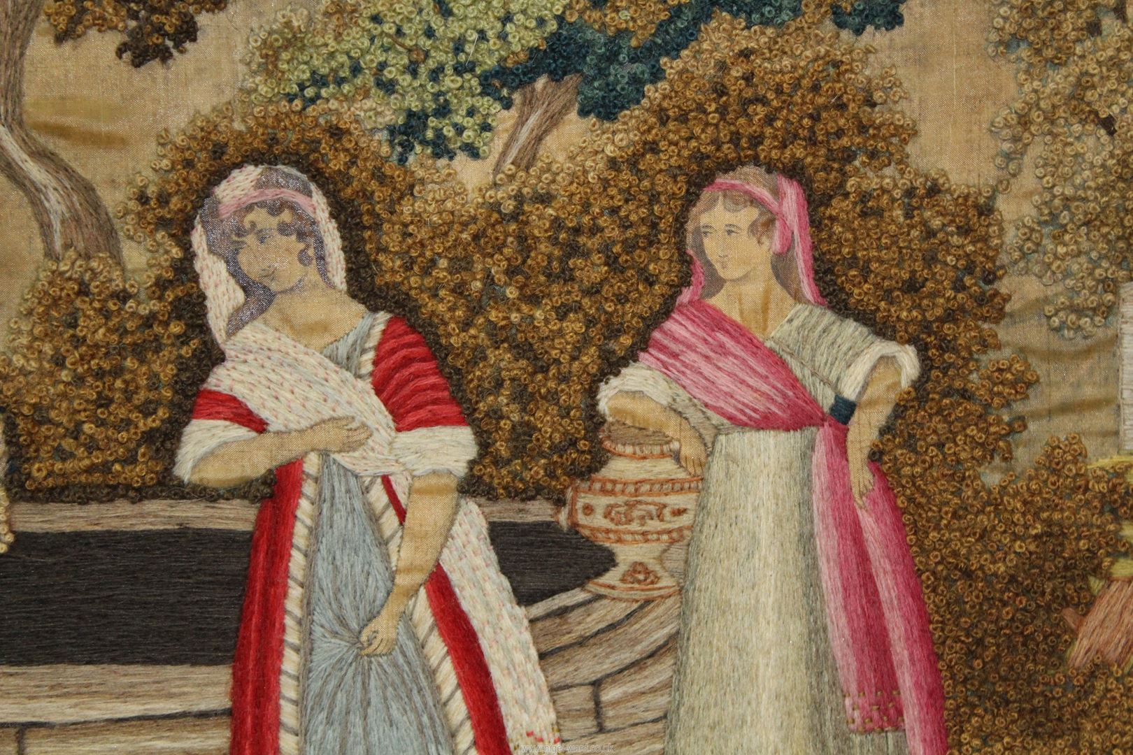 A Crewel work on silk embroidery of a Middle Eastern landscape with people and animals gathering - Image 2 of 3