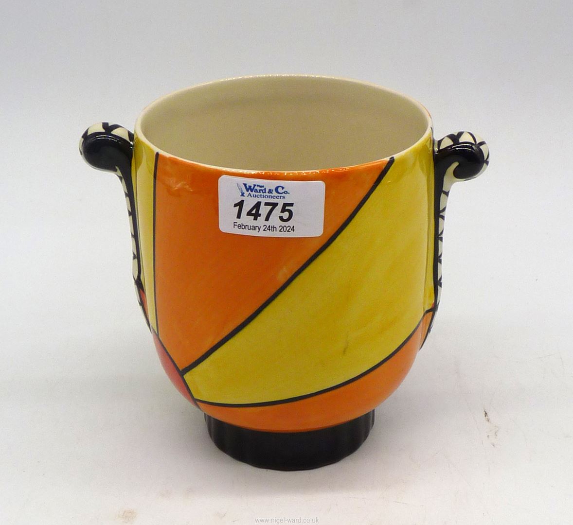 A Lorna Bailey Sunburst Pot [early design] 5 3/4" tall x 4 3/4" diameter.