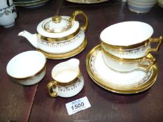 A George Jones crescent tea for two with rich gilding comprising eight pieces including tea pot.