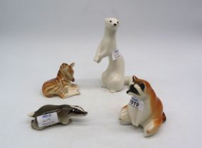 Four USSR ornaments including; Racoon, Badger, Zebra foal and Stoat.