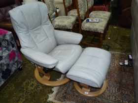 An as new Ekornes Stressless reclining grey leather upholstered swivel Armchair together with the