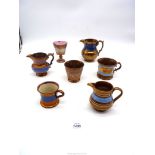 Seven items of 19th c copper lustre to include a pink lustre goblet , jugs, mugs etc.