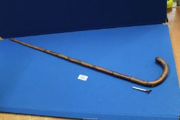 A bamboo walking cane with silver mounted hidden compartment for concealed pencil, Birmingham 1906,