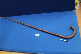 A bamboo walking cane with silver mounted hidden compartment for concealed pencil, Birmingham 1906,