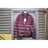 A ladies size 8 quilted Barbour jacket in metallic purple, with tags.