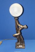 An Art Deco style figural lamp of a nude lady, with white globe shade, 22 3/4'' tall overall.