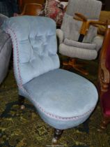 An Edwardian pale blue Dralon upholstered buttoned back Chair standing on turned front legs with