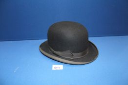 A black Bowler hat, size 7 by Hillhouse & Co, Bond Street, London.