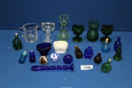 A small quantity of clear and coloured glass eye baths, potion bottles, etc.
