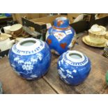 A large Oriental ginger jar in blue with fan shape reserves of bamboo and peony,