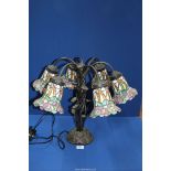 A six branch floral Tiffany style Lamp with entwined leaf base, 18 3/4'' tall.