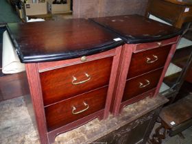 A pair of darkwood Bedside Chests of two short drawers,