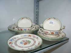 Four Copeland Spode soup Coups and saucers and a soup bowl in Chinese Rose motif.