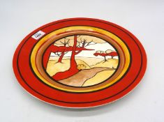 An Elements of Fire Deco style Charger with bright red rim, centre scene of orange/red trees,