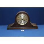 A Napolean hat shaped mantle Clock having Arabic numerals, 17" wide x 9 1/2" high.