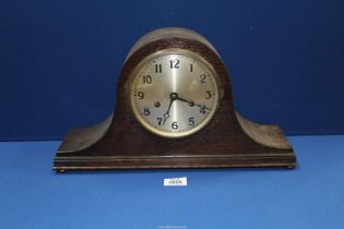 A Napolean hat shaped mantle Clock having Arabic numerals, 17" wide x 9 1/2" high.