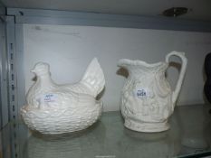 Two pieces of Portmeirion china; a white hen on nest and a Heritage Collection jug.
