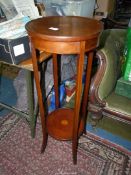 A boxwood strung Mahogany Jardiniere Stand, the legs united by a lower shelf,